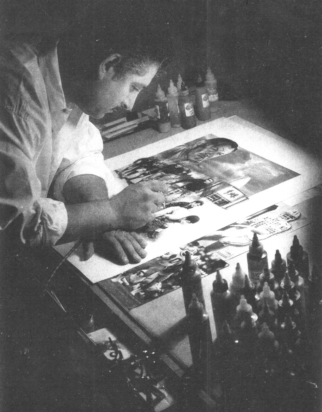 Artist Ray Simon Painting at his desk